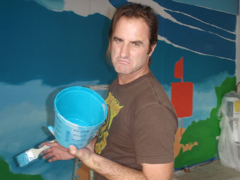 Drew Brophy with a bucket of paint